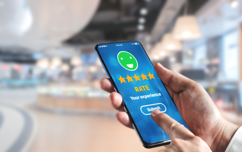 Person rating their experience on a smartphone, highlighting eCommerce customer engagement and retention techniques.